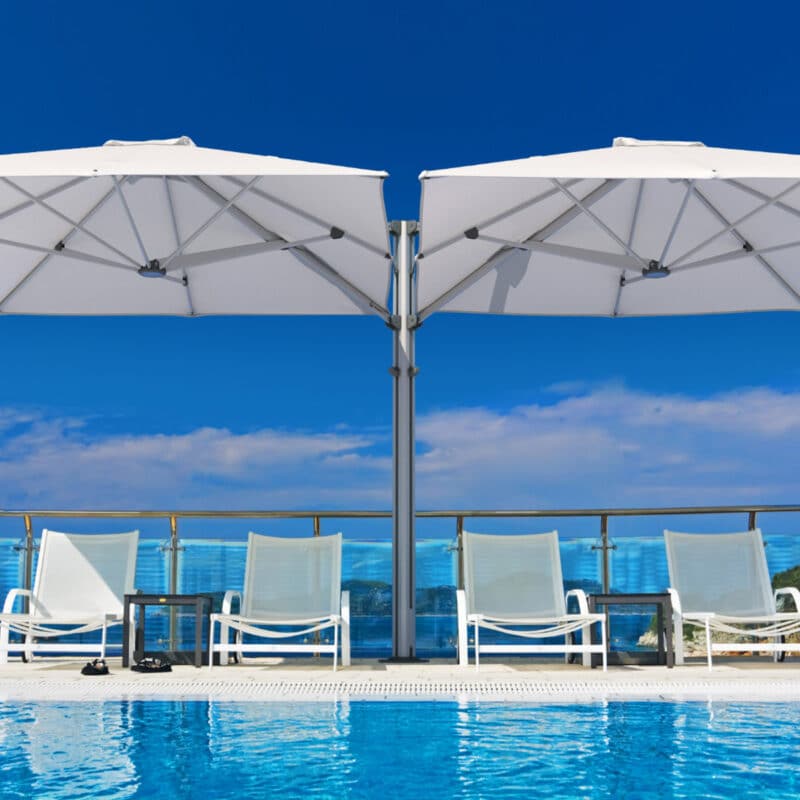 Unity umbrella cairns poolside