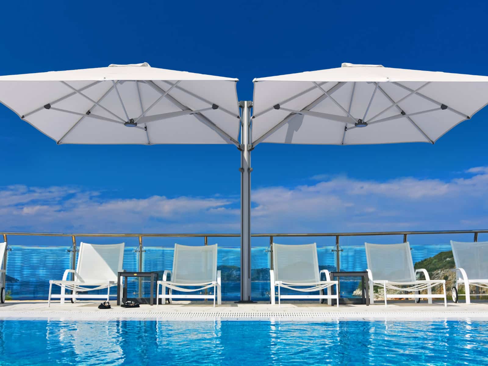 Unity umbrella cairns poolside